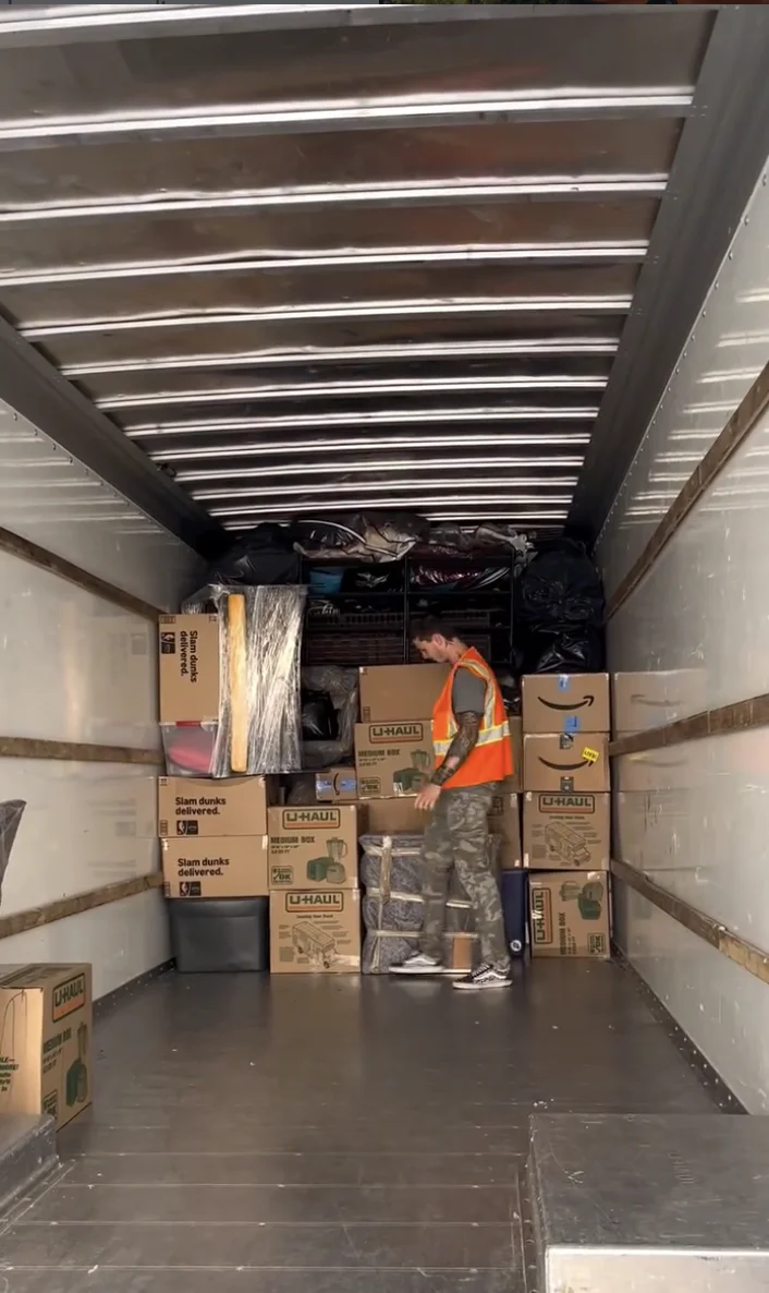 Moving truck loaded with boxes and household furniture